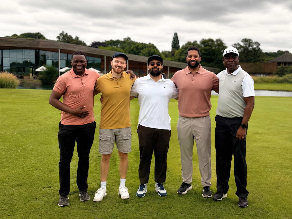 Five friends smiling together on a golf course after a round